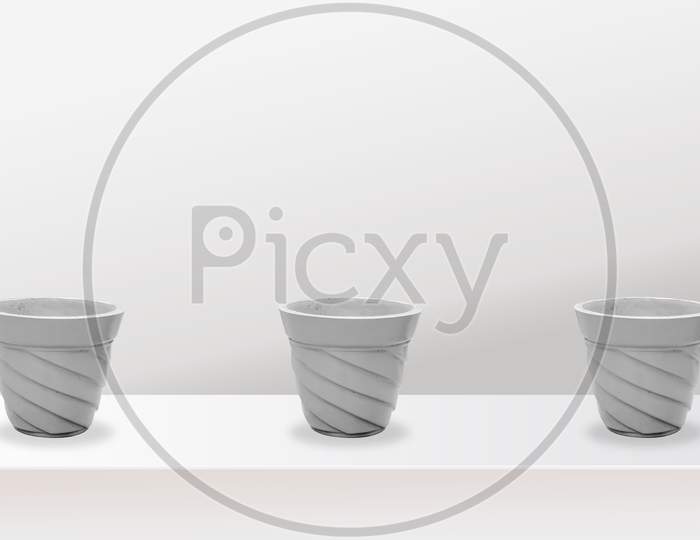 empty flower pots of different colour and different prospective, isolated on white background, copy space.