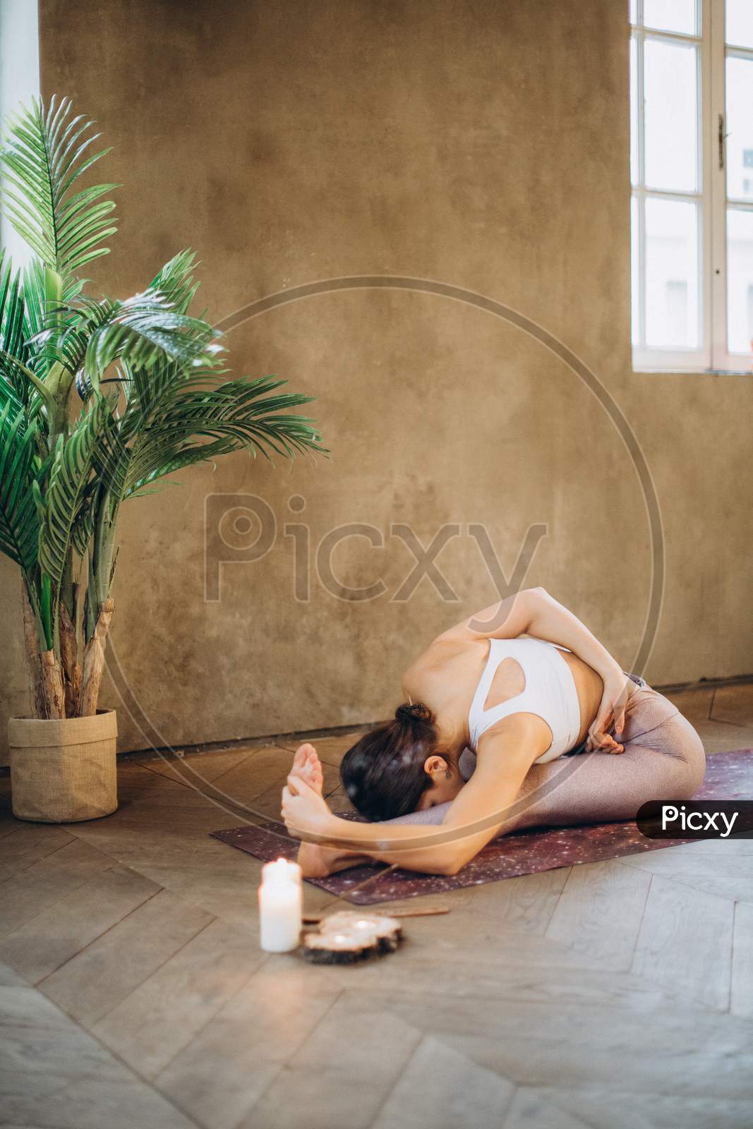 Woman Practicing Yoga at Home