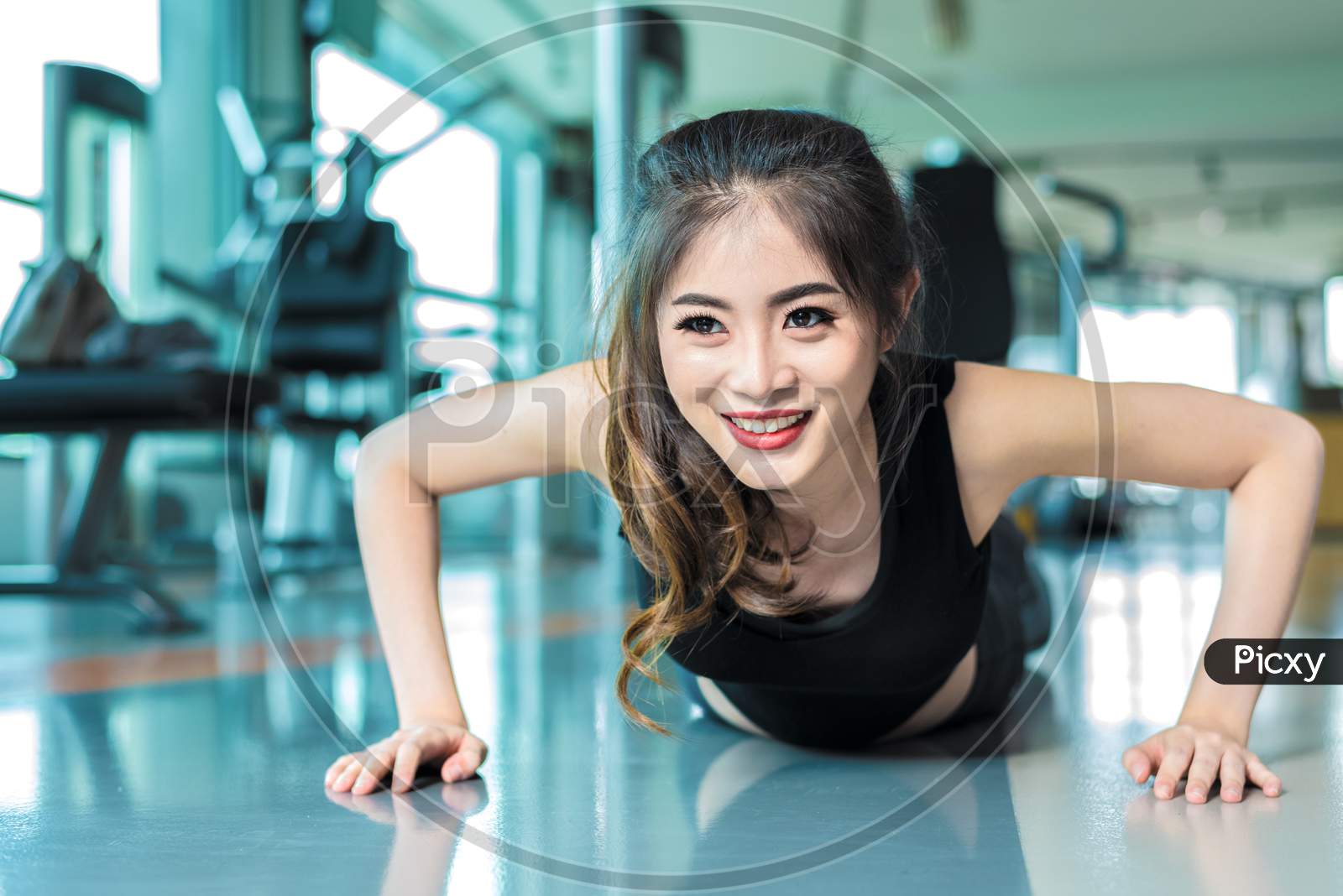 Asian Woman Fitness Girl Do Pushing Ups At Fitness Gym. Healthcare And Healthy Concept. Training And Body Build Up Theme. Strength And Beauty Concept
