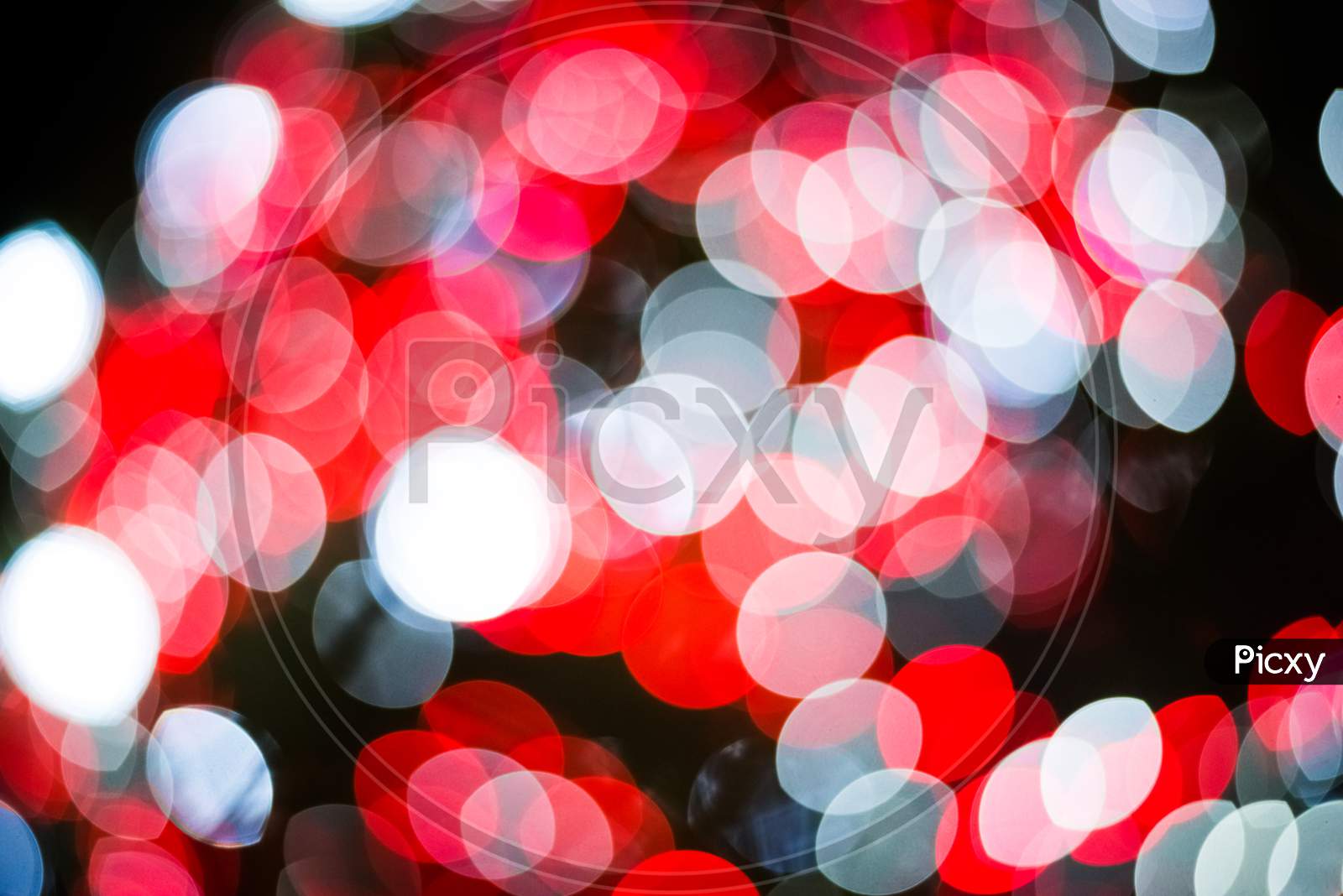 Red And White Abstract Blurry Light Bokeh Background For Overlay. Anniversary And Celebration Concept. New Year Festival And Christmas Theme