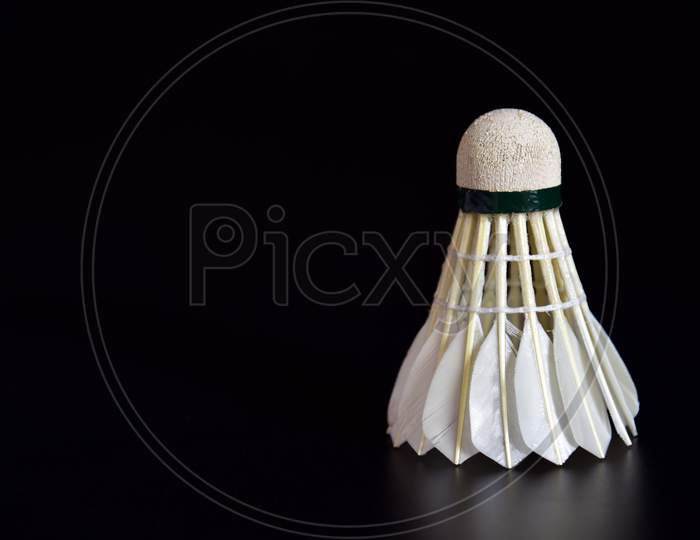 Badminton Ball Or Shuttle Cock On The Black Background With Copy Space For Advertising, Sport Concept, Fitness Concept