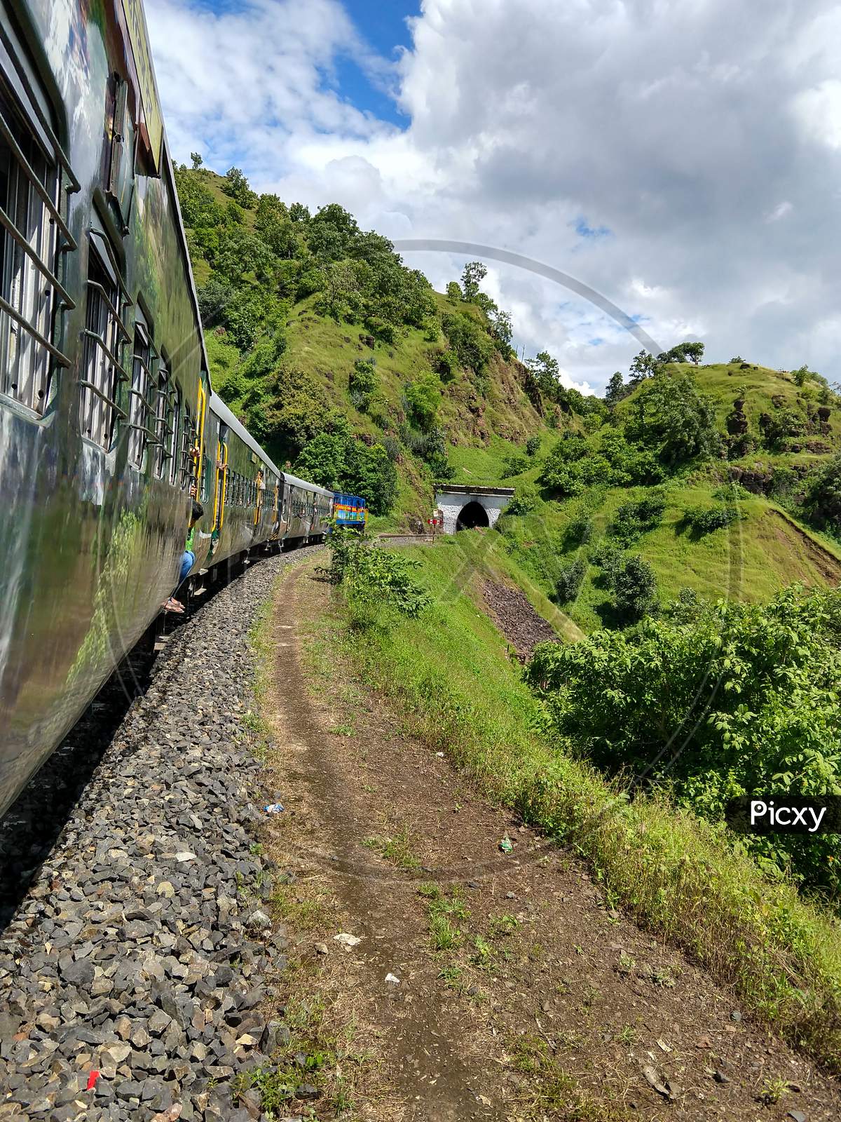 A Train Enter In A Tunnel In Mountain, Indian Railway- Madhya Pradesh, India