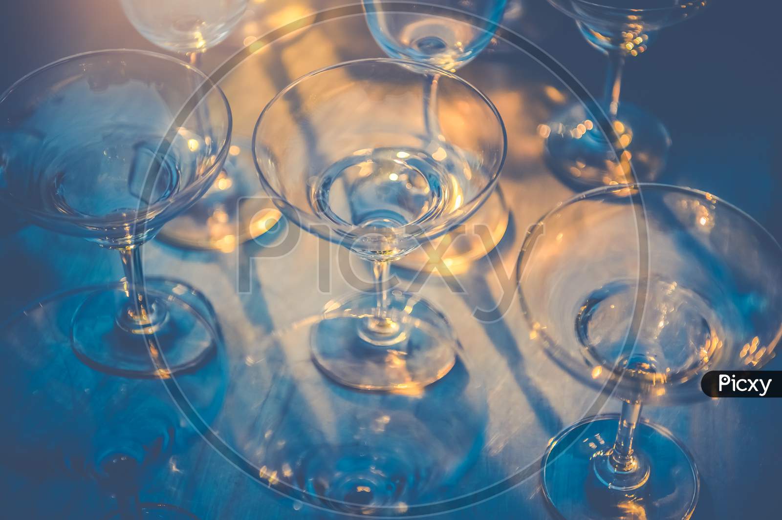 Row Of Wineglasses On Table In Nightclub Bar And Pub Restaurant. Glassware And Drinking Beverage Concept