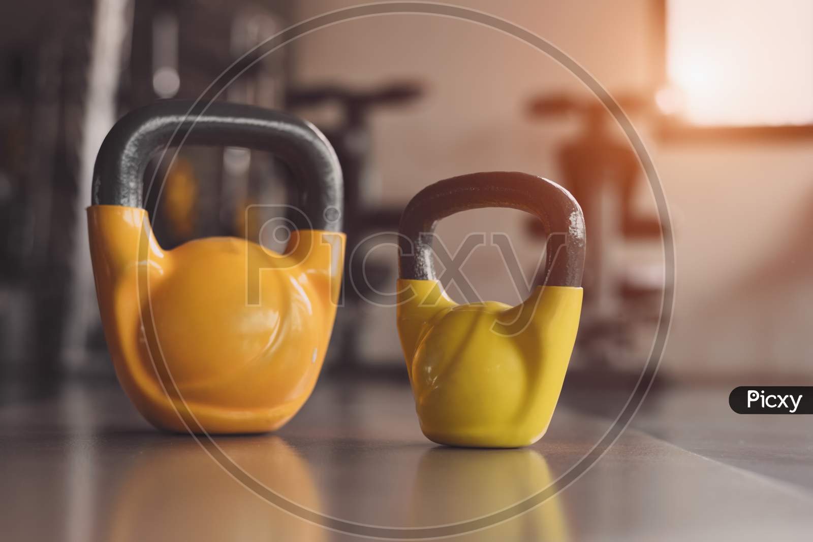 Kettlebells Or Dumbbells On Fitness Gym Floor. Heavy Weight Sports Equipment And Accessories In Workouts Training Club. Body Building Muscle And Strength Weightlifting. Lifestyle And Indoors Activity.