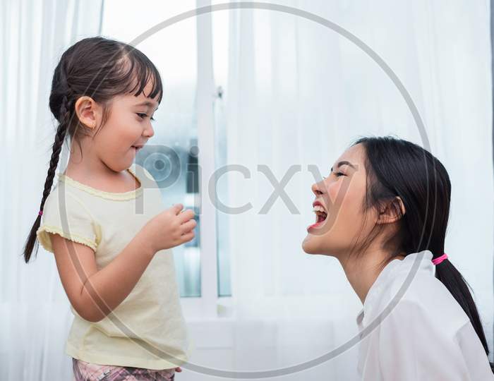 Daughter Feeding Mom With Potato Chip Funny. Back To School And Education Concept. Children And Kids Theme. Home Sweet Home And Nursery Theme.