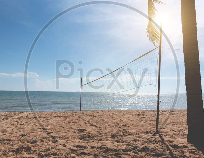 Beach With Volleyball Net. Seascape And Ocean Concept. Summer And Vacation Theme. Sunshine Element. Vintage Matte Tone