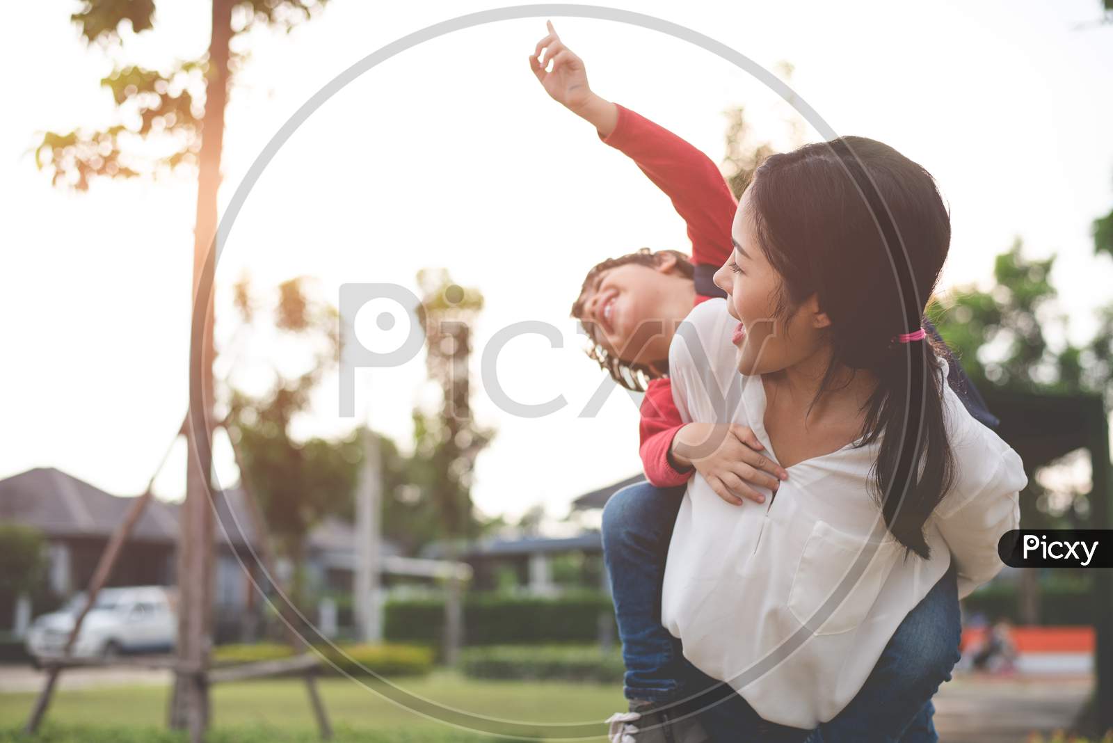 Image of Mom Hug And Carry Her Son. Preparing To Send Her Children Back To  School In Morning. Education And Back To School Concept. Happy Family And  Loving Of People Theme-PS452963-Picxy