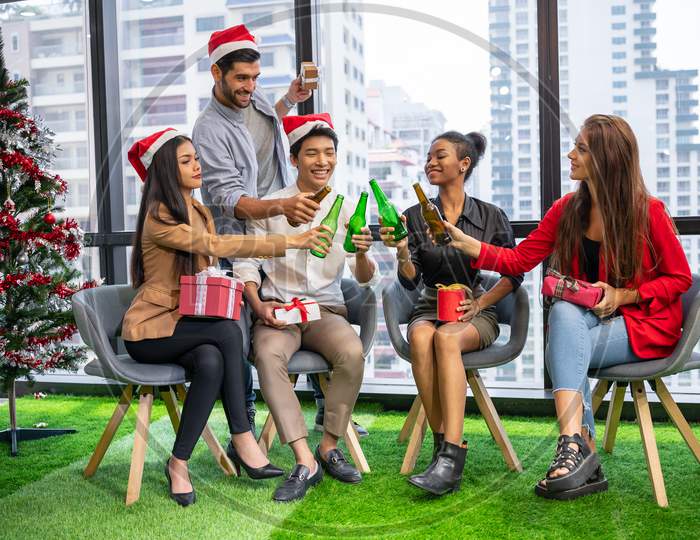 Group Of Business Diversity Colleague Teamwork Celebaring For New Year Party In Modern Urban Office Background. Friends Having Enjoy Party With Alcoholivd Drink Together. Multi Ethics People Lifestyle