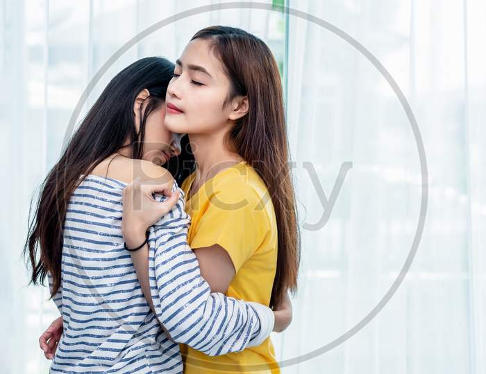 Two Asian Lesbian Women Looking Together In Bedroom. Couple People And Beauty Concept. Happy Lifestyles And Home Sweet Home Theme. Embracing Of Homosexual. Love Scene Making Of Female
