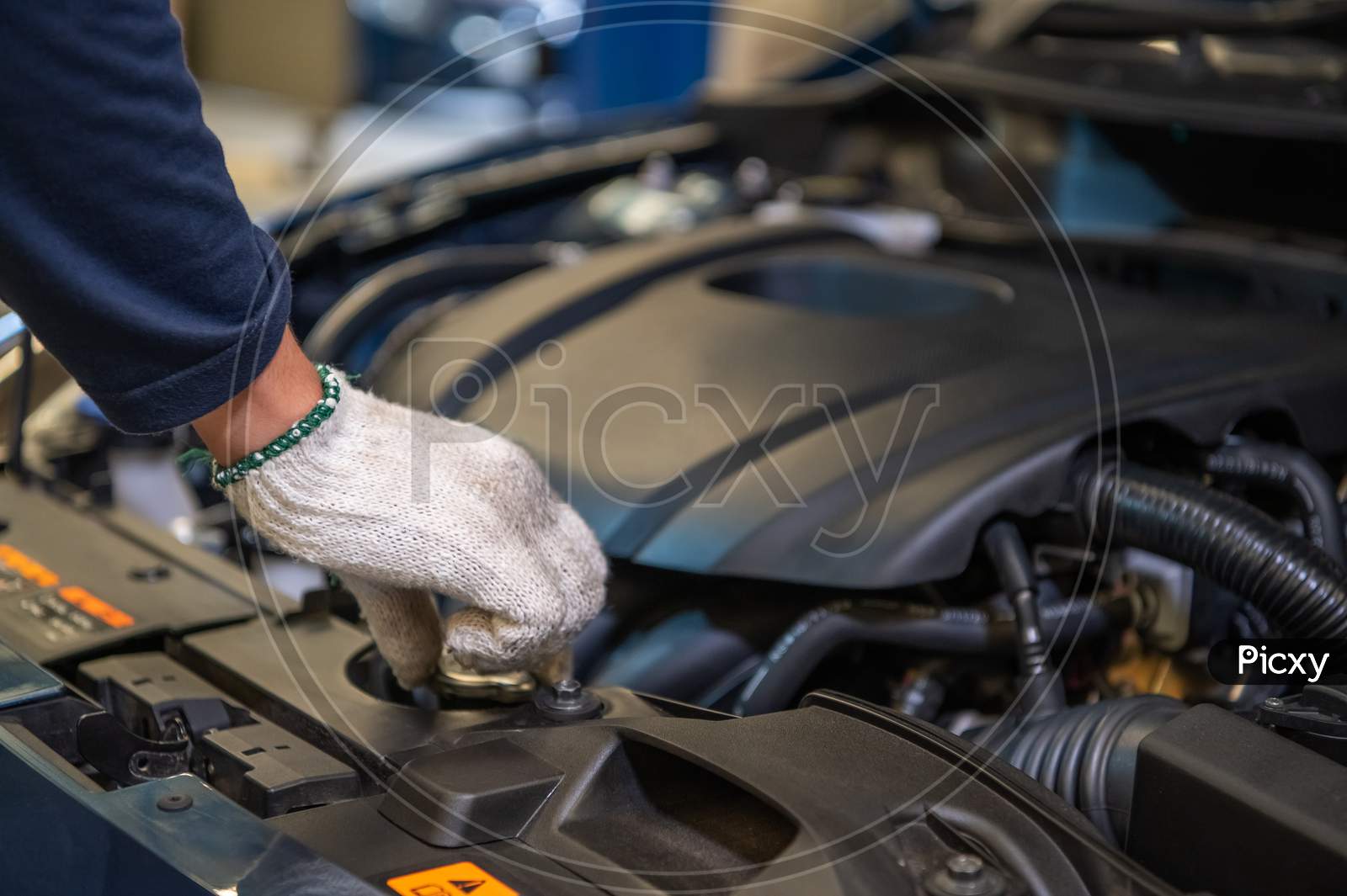 Closeup Hand Of Auto Mechanic Examine Car Engine Breakdown Problem In Front Of Automotive Vehicle Car Hood. Safety Technical Inspection Care Check Service Maintenance For Customer Before Road Trip