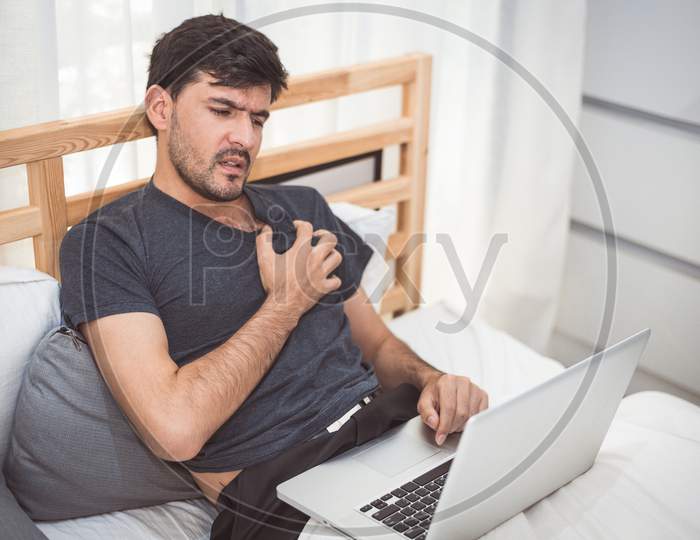 Businessman Using Laptop Computer Overnight Cause Heart Attack Failure Symptom. Healthcare And Medical Wellness Of Overworked People Lifestyle Concept. Technology And Workaholic Illness Theme.