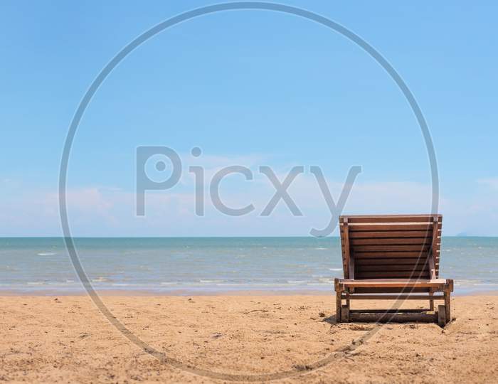 Sunbath Chair On The Beach With Clearly Blue Sky Background. Relax And Vacation Concept. Object Theme.