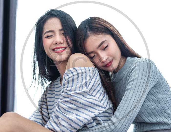Two Asian Lesbian Women Hug And Embracing Together In Bedroom. Couple People And Beauty Concept. Happy Lifestyles And Home Sweet Home Theme. Homosexual Life Theme. Love Scene Making Of Female