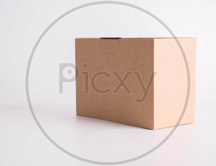 Brown Paper Box On White Background. Parcel And Post Delivery Concept. Object And Container Theme.