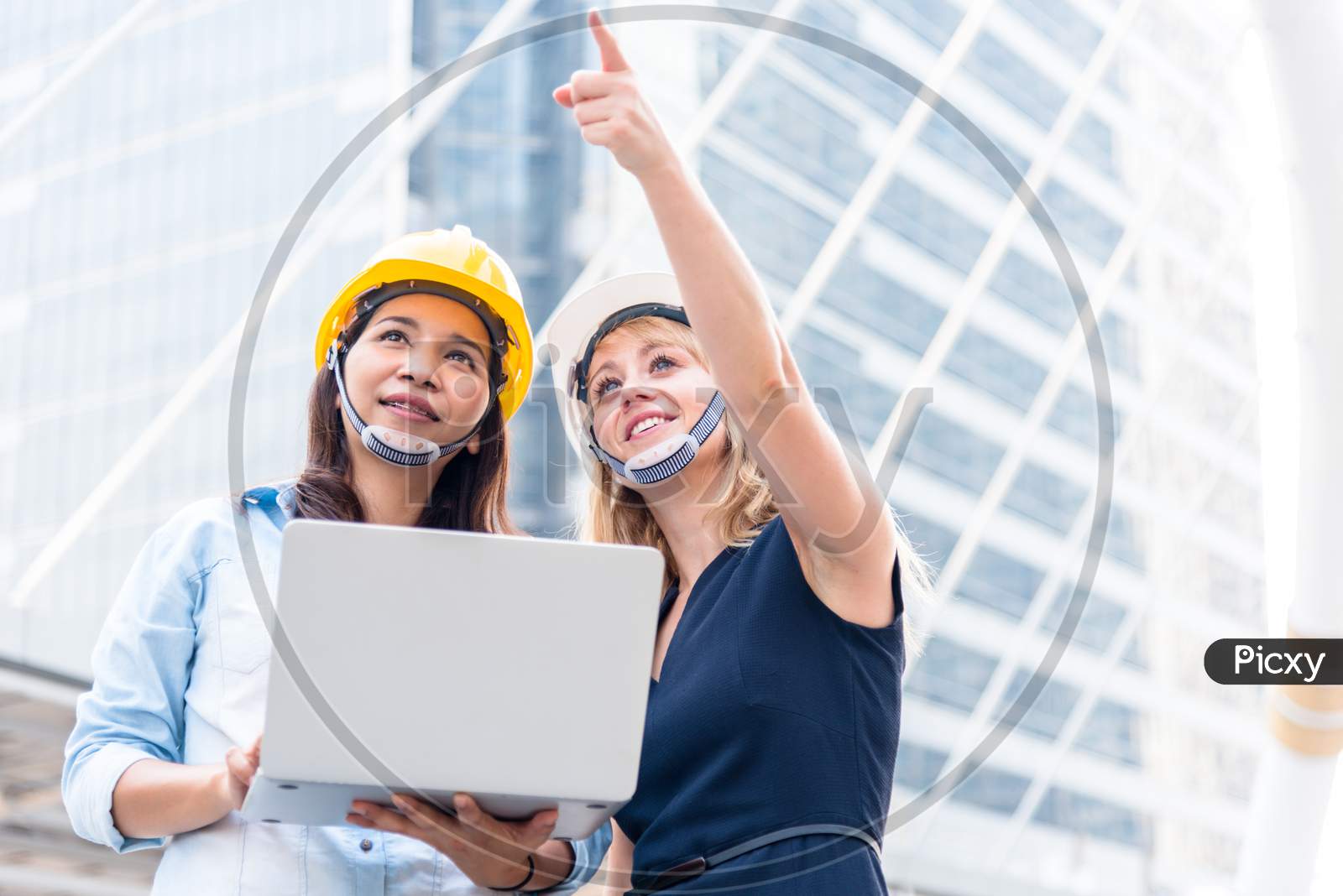 Two Women Engineering Surveying For Startup And Launching New Project. Building And Construction Concept. Business And Happiness Of Cooperation Concept. Civil Engineer Theme. City And Urban Theme