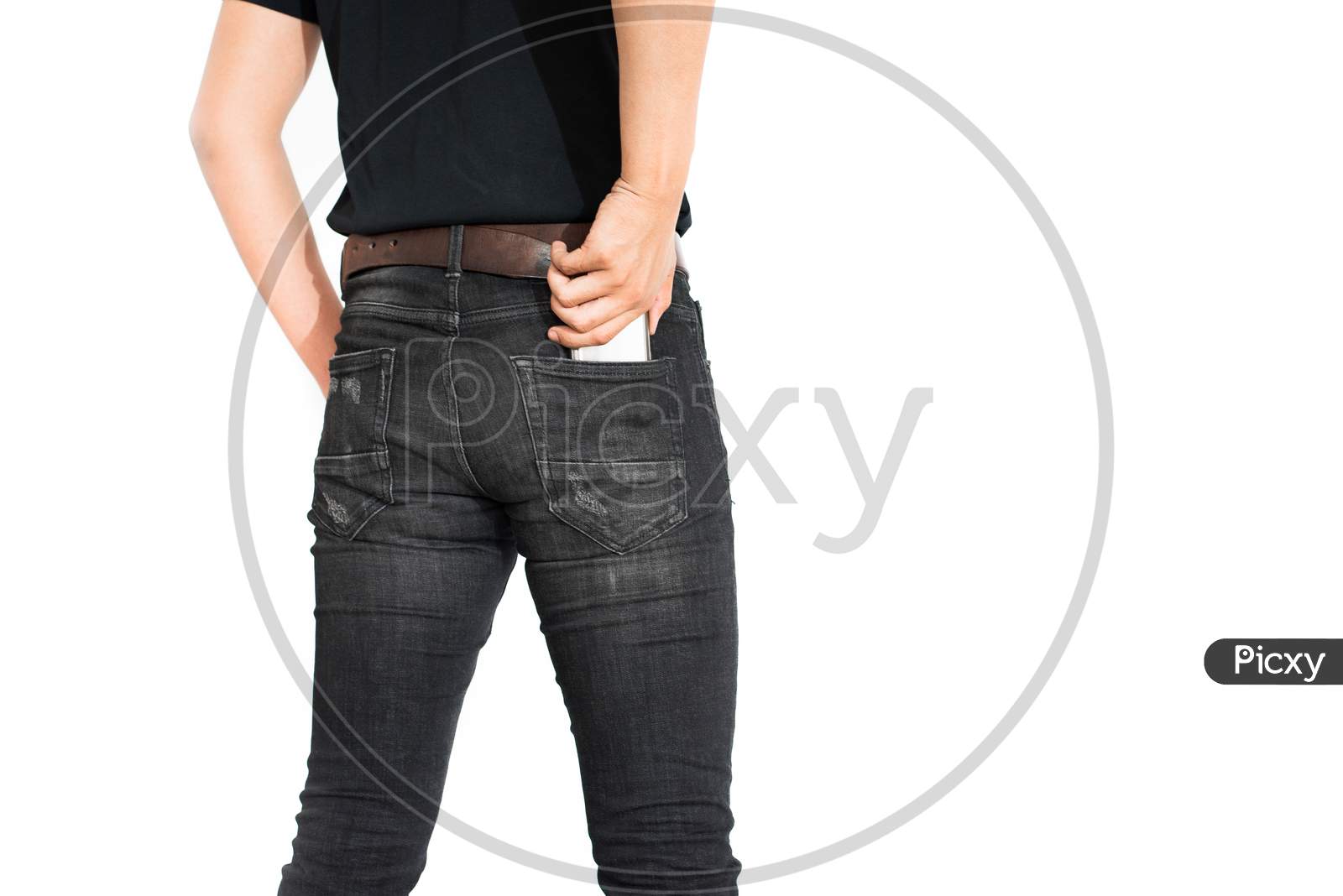 Back View Of Lower Body Of Man Putting Smart Phone Into Pocket On Isolated White Background. Man Wearing Jeans And Casual. Technology And Lifestyle Concept