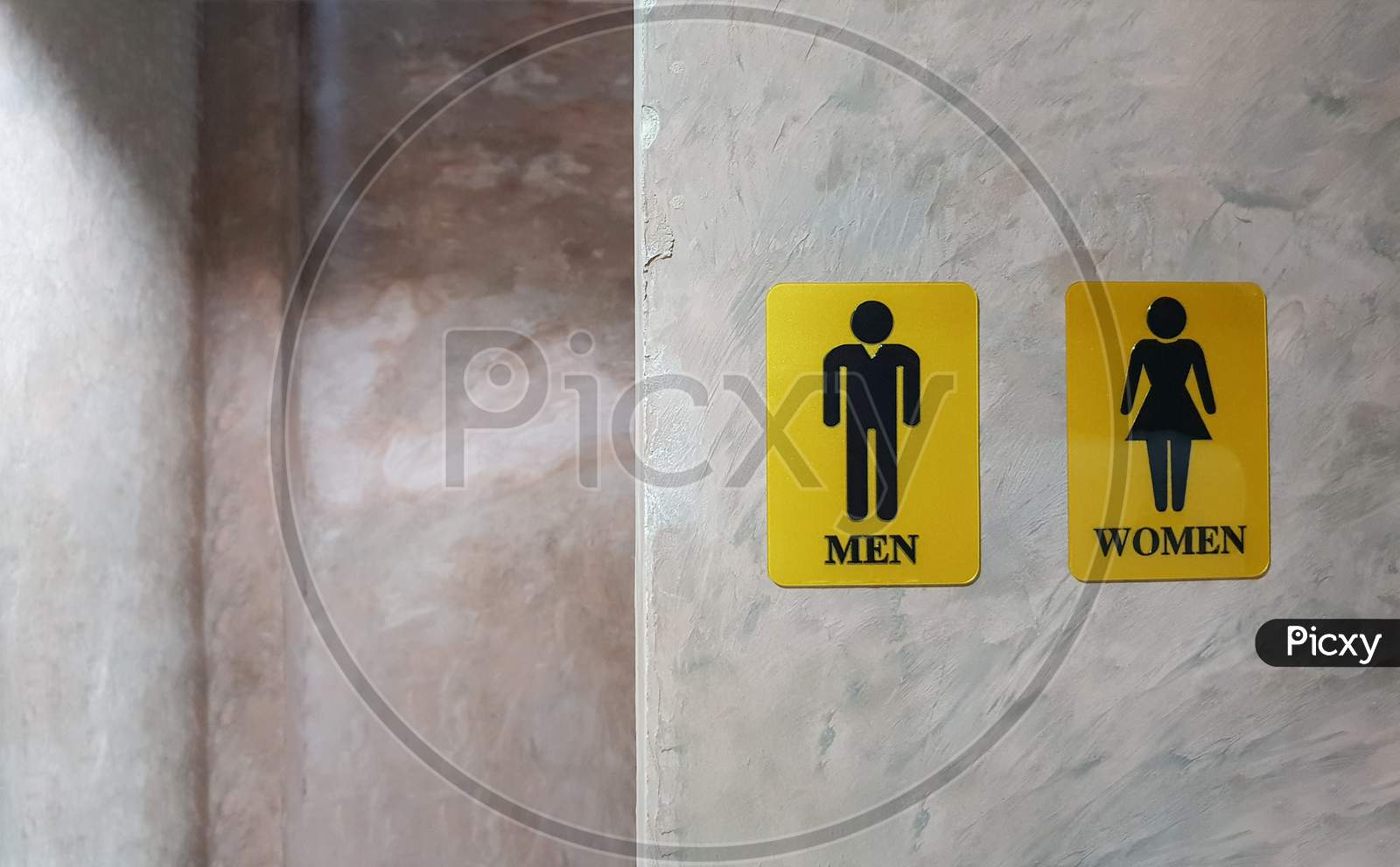 Public Toilet Of Men And Women. Sign Of Lady And Gentleman Washroom Called Wc. Mixed Gender Symbol Toilet And Restroom Behind Concrete Wall Decorate By Vintage Style In Department Store. Text Message
