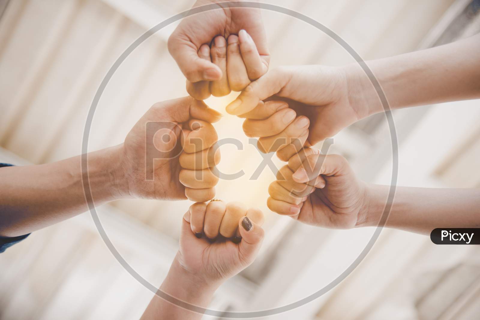 Fist Bump Of Friendship And Teamwork For Startup New Project. Business And Togetherness Concept. Cooperation And Successful Concept. People And Hands Theme. Warm Tone Filter
