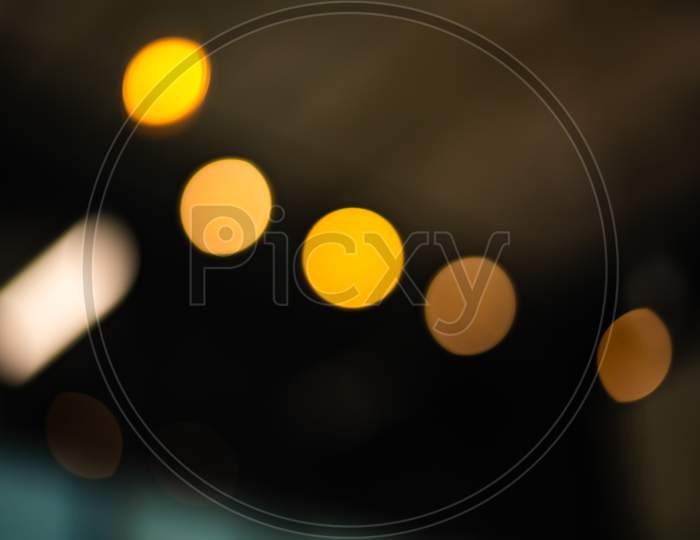 Blurry Background Of City Light In The Nightlife. Abstract And Wallpaper Concept. Traffic And Metropolis Theme. Defocused Photo