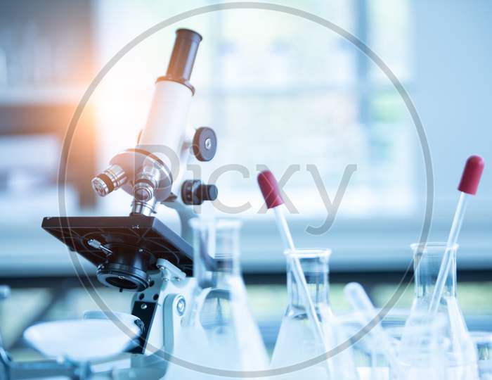 Medical Laboratory Microscope In Chemistry Biology Lab Test. Scientific Research And Development And Healthcare Concept Background