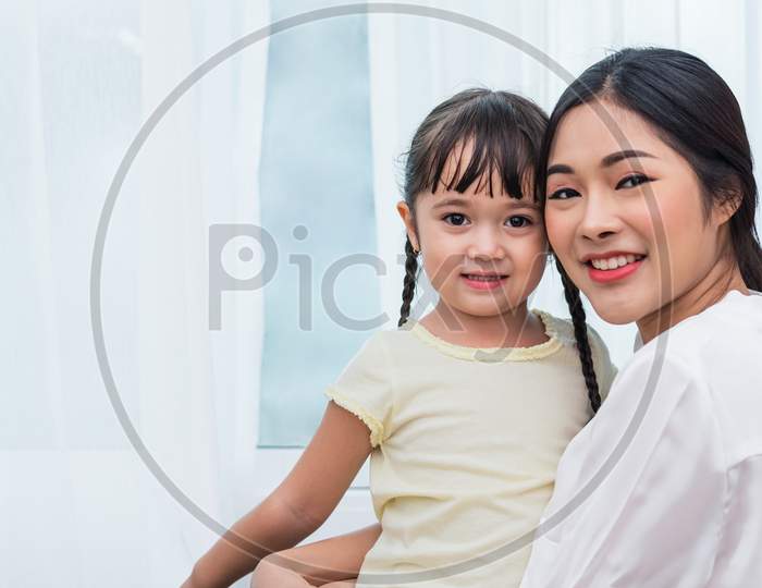 Single Mom And Daughter Portrait. Happy Family And People Concept. Mother And Children Day Theme.