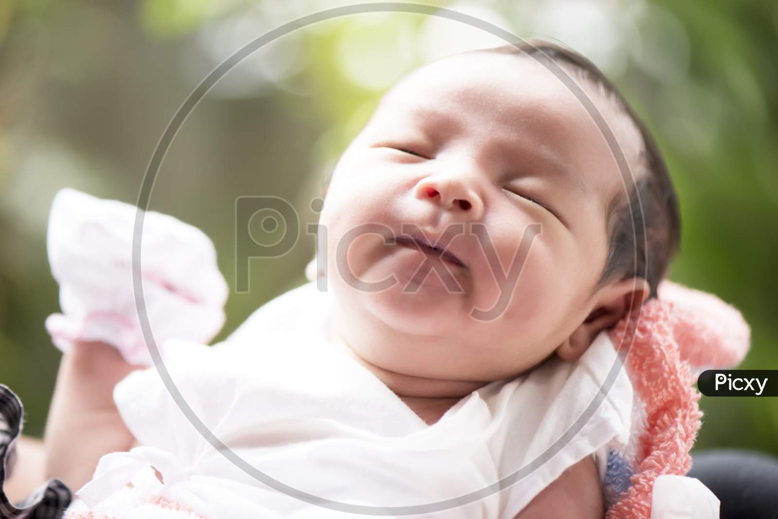 Newborn Baby Smiling In Mother'S Hands, Selective Focus In Her Eyes, Family Concept