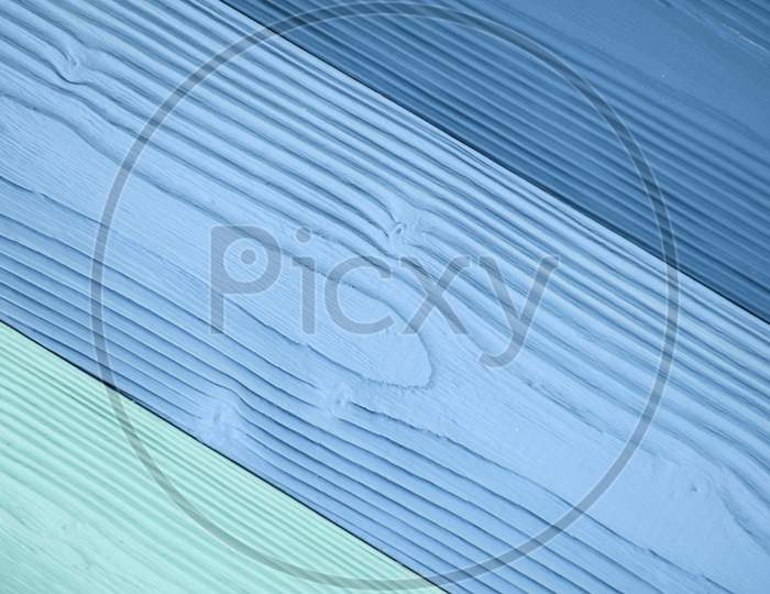 Top Diagonal View Of Blue Wooden Textured Background Backdrop. Abstract Wallpaper Pastel Blue Ocean Color