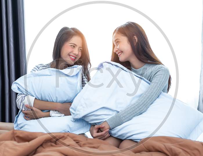 Image Of Two Asian Lesbian Women Looking Together In Bedroom Couple People And Beauty Concept