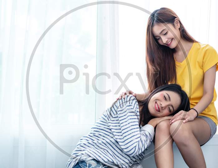 Asian Couple Take Care Together Near White Window With Soft Sunshine In Happiness Moment Together. People And Lifestyles Concept. Lesbian And Friendships Theme. Lgbt Pride Theme.