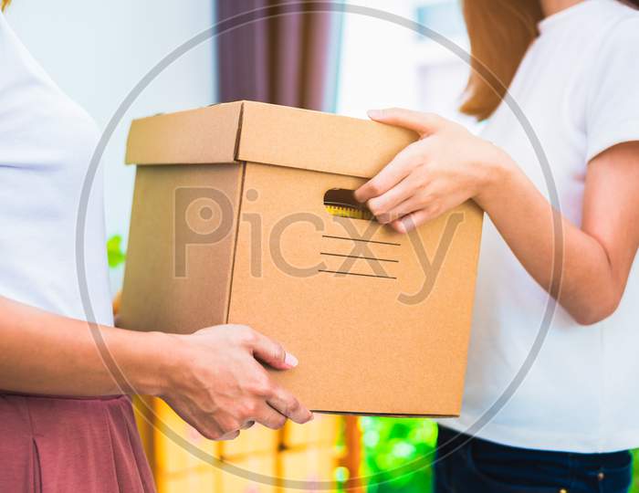 Delivery Box Of Products And Women Hands When Service At Home Or Office. Business And Marketing Concept. Online Shopping And Express Delivery Theme