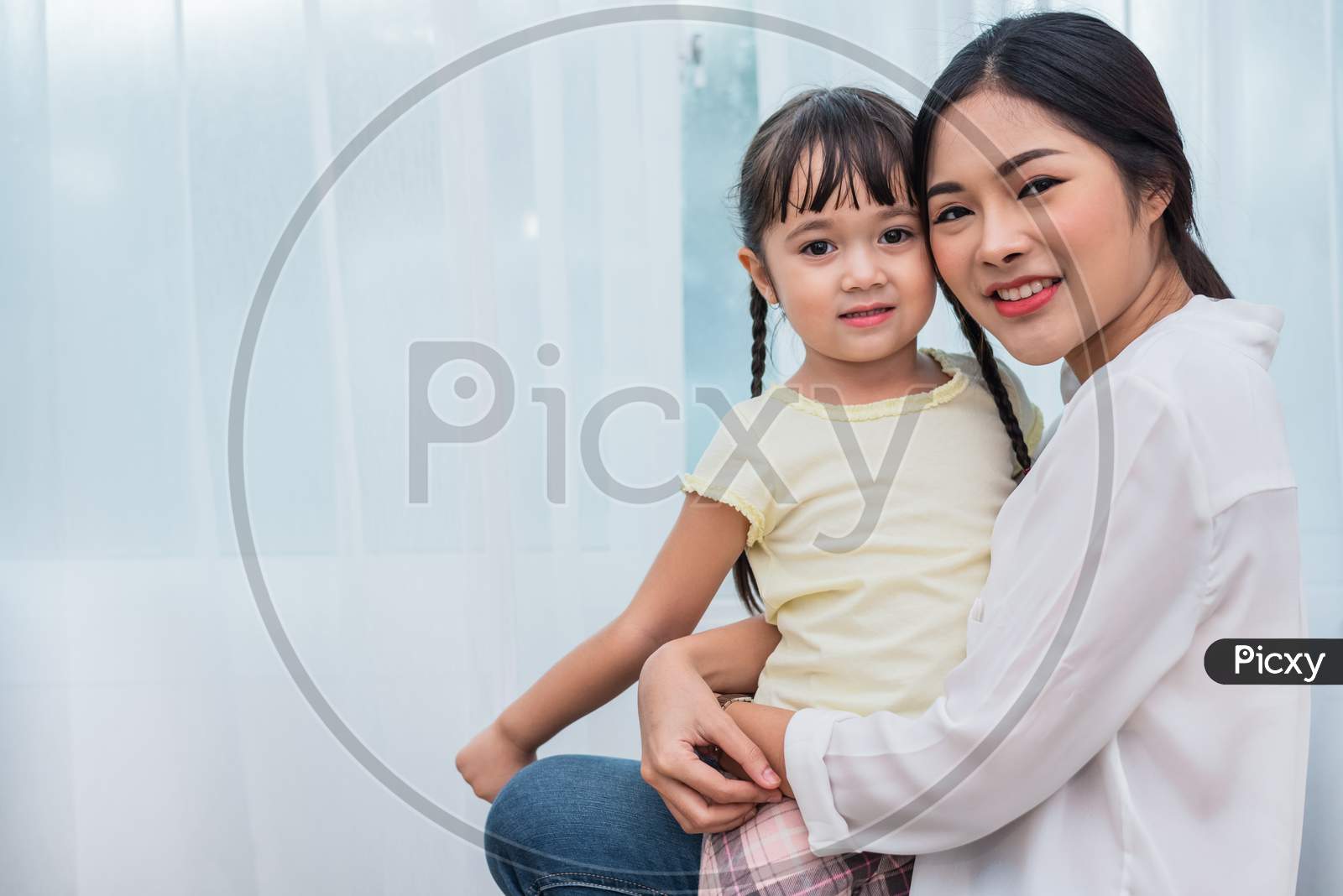 Single Mom And Daughter Portrait. Happy Family And People Concept. Mother And Children Day Theme.