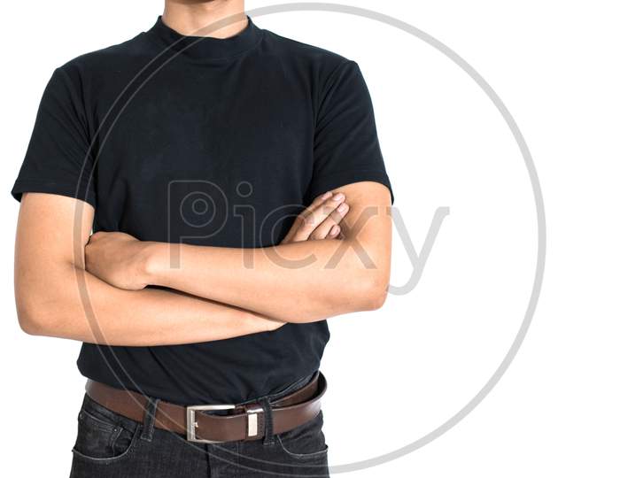 Man Standing And Do Arms Crosses On Isolated White Background. Black T-Shirt And Jeans With Brown Belt In Fashion Concept