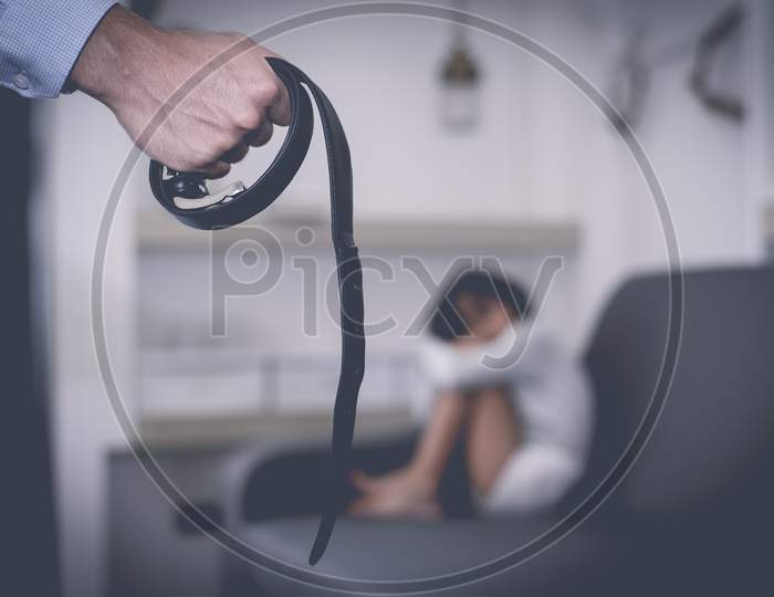 Parents Abuse The Child, Girl Fearing At Her Father, Selective Focus At Belt