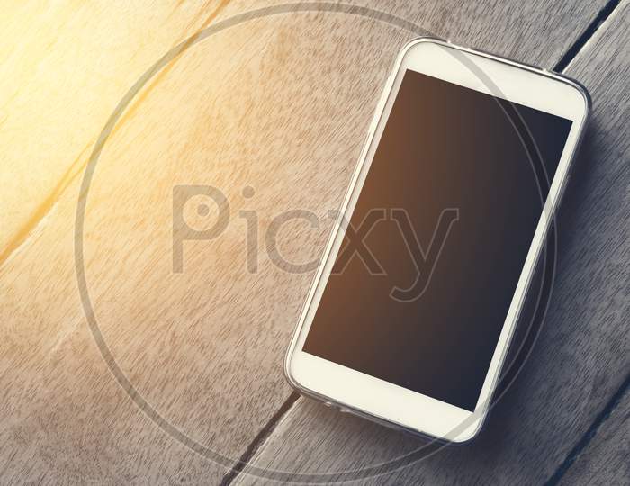 Smart Phone On The Wood Background Wallpaper