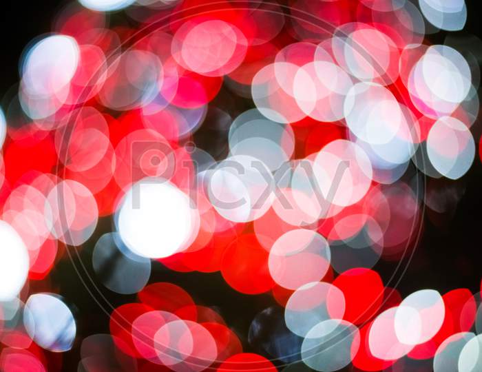 Red And White Abstract Blurry Light Bokeh Background For Overlay. Anniversary And Celebration Concept. New Year Festival And Christmas Theme