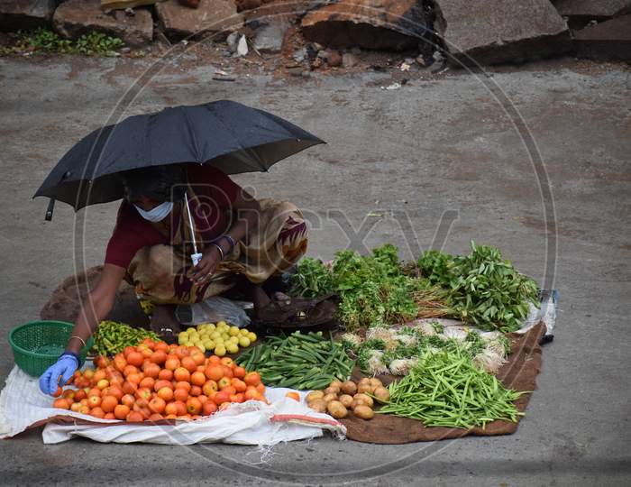Street Vendor selling vegetables with all precautions