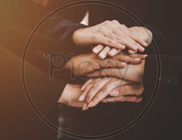 Business People Making Pile Of Hands For Startup New Project. Business And Togetherness Concept. Cooperation And Successful Concept. Close Up View