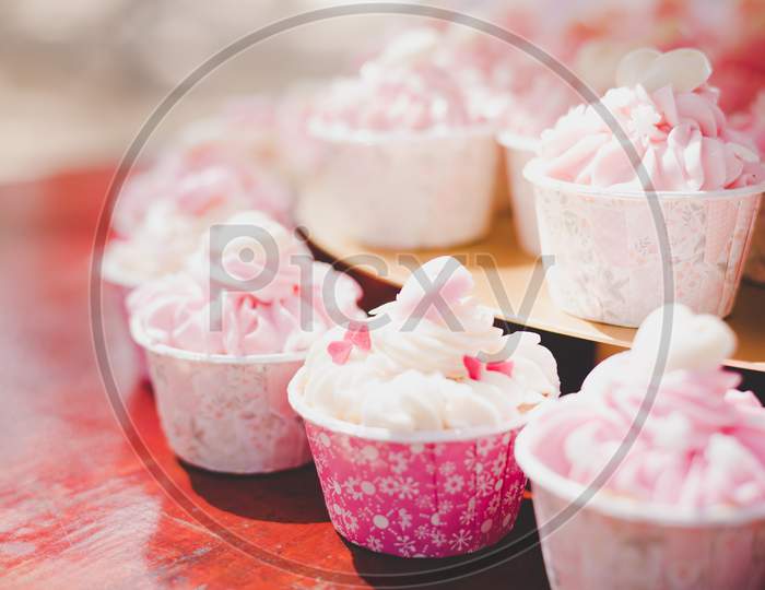 Pink Cup Cakes In Wedding Ceremony. Decoration And Celebration Concept. Food And Dessert Theme.