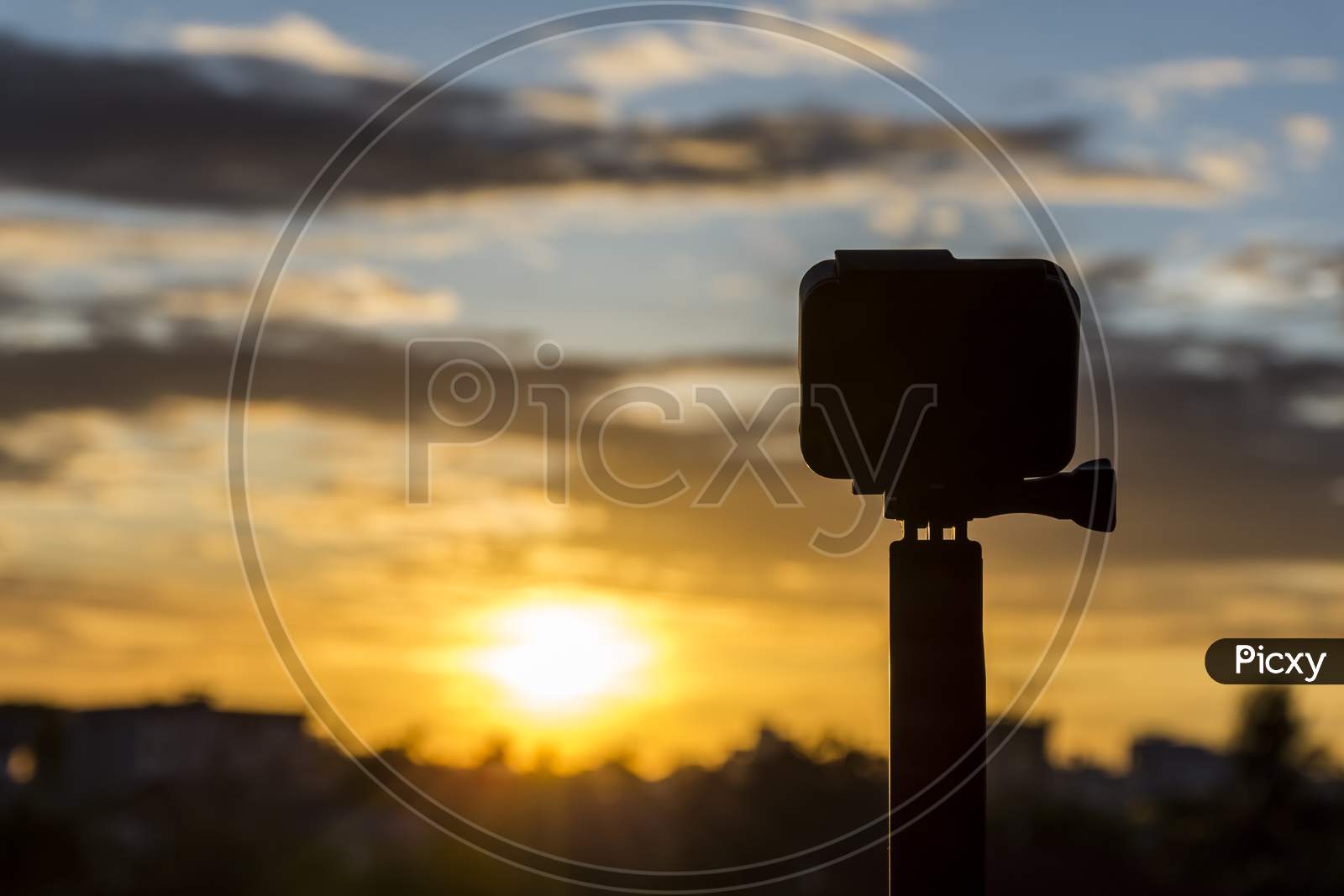 Silhouette Action Camera In Front Of The Twilight Sky, Technology And Nature Concept