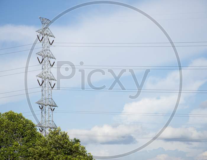 High Voltage Pole On The Top Of Mountain Hill, Nature And Technology Concept