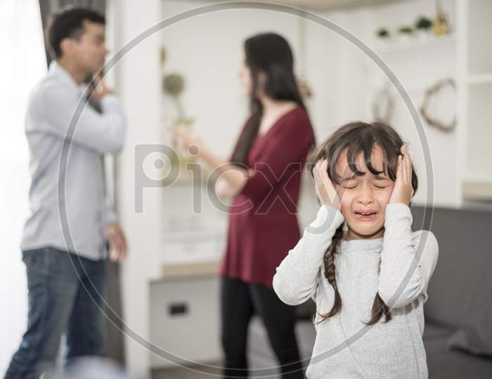 Little Girl Was Crying Because Dad And Mom Quarrel, Sad And Dramatic Scene, Family Issued, Children'S Rights Abused In Early Childhood Education And Social And Parents Care Problem Concept