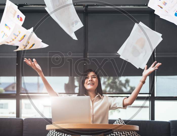 Asian Beauty Businesswoman Throwing Paperwork Into The Air. Successful And Achievement Concept. Business And Occupation Concept. Freelance And Business Owner Theme.