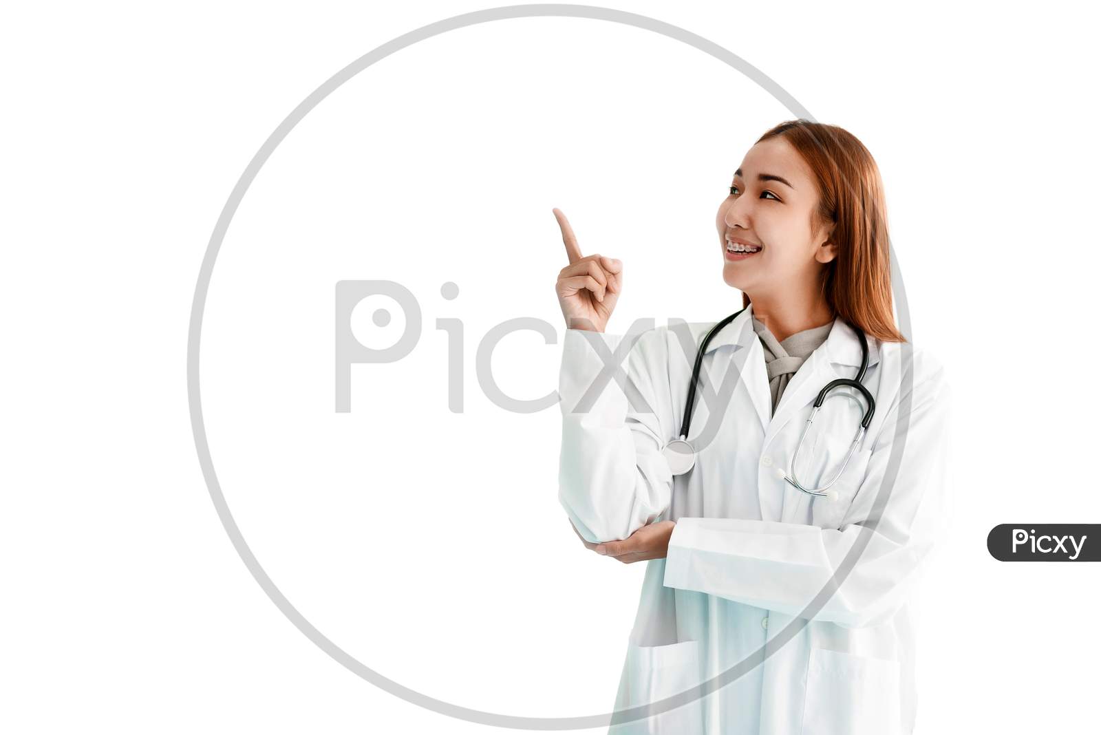 Women Doctor Pointed Her Finger And Looking At Beside And With Stethoscope On White Isolated Background. Medical And Healthcare Concept. People And Technology Theme.