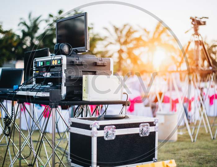 Dj Mixing Equalizer At Outdoor In Music Party Festival With Party Dinner Table. Entertainment And Event Organizer Concept. Concert And Musical Theme