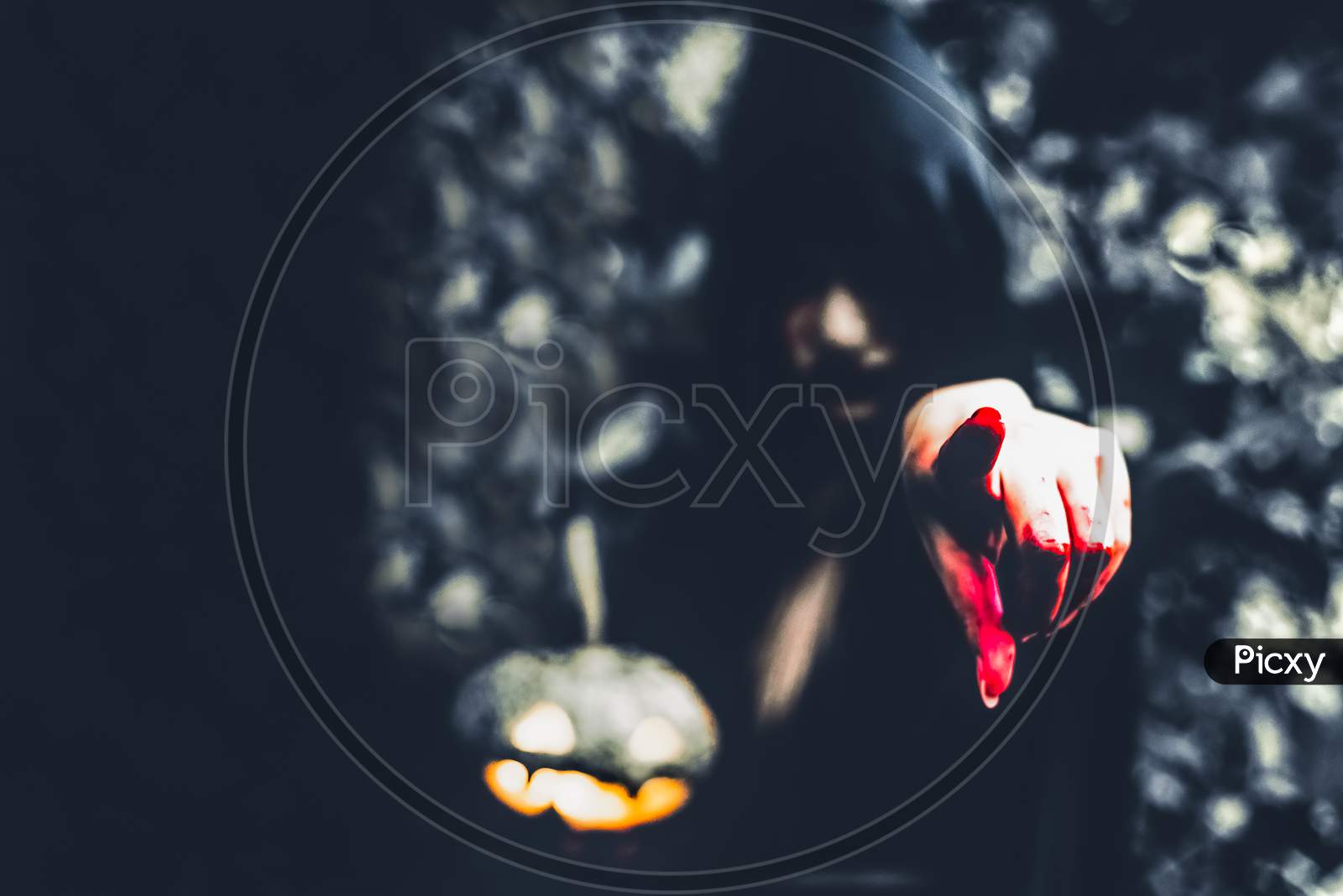 Close Up Of Bloody Wizard Hand Pointing To The Front. Pumpkin Lantern Element. Horror And Ghost Concept. Halloween And Scary Movie Theme. Mystery Forest Theme.