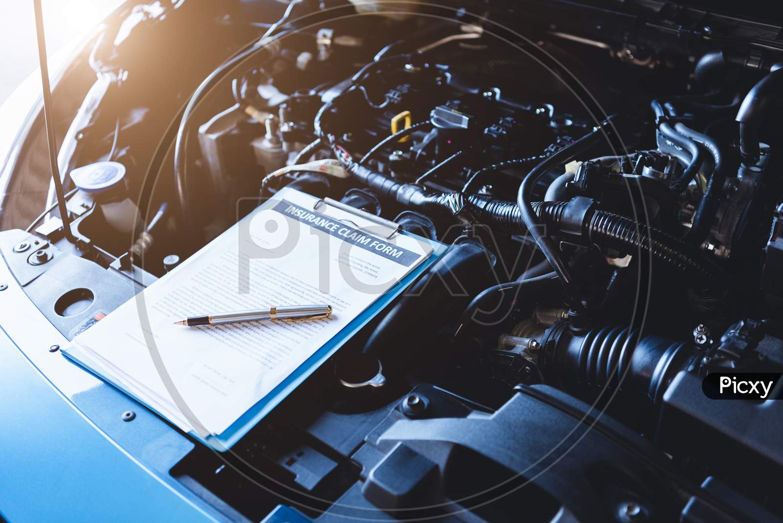 Clipboard On Car With Car Insurance Claim Form For Customer Maintenance Vehicle Checklist In Auto Repair Shop Garage. Engine Repair Service Concept. Business Technical Mechanics Support For Fixing Car