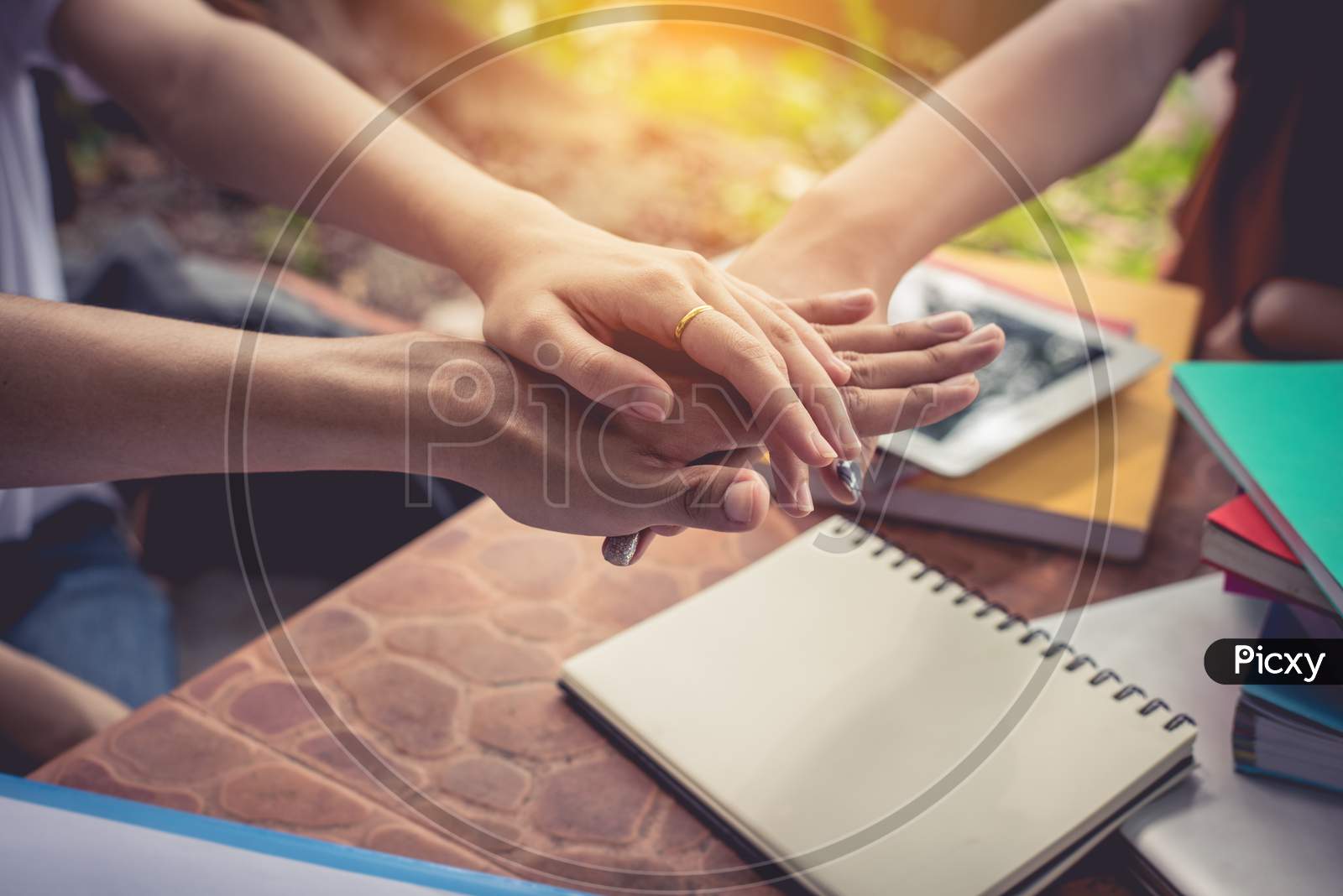 Close Up Hands Of People Putting And Stacking Their Hands Together. Friendship And Unity Concept. Teamwork And Successful Concept. Parts Of Body And Working People Theme. Business And Marketing Theme.