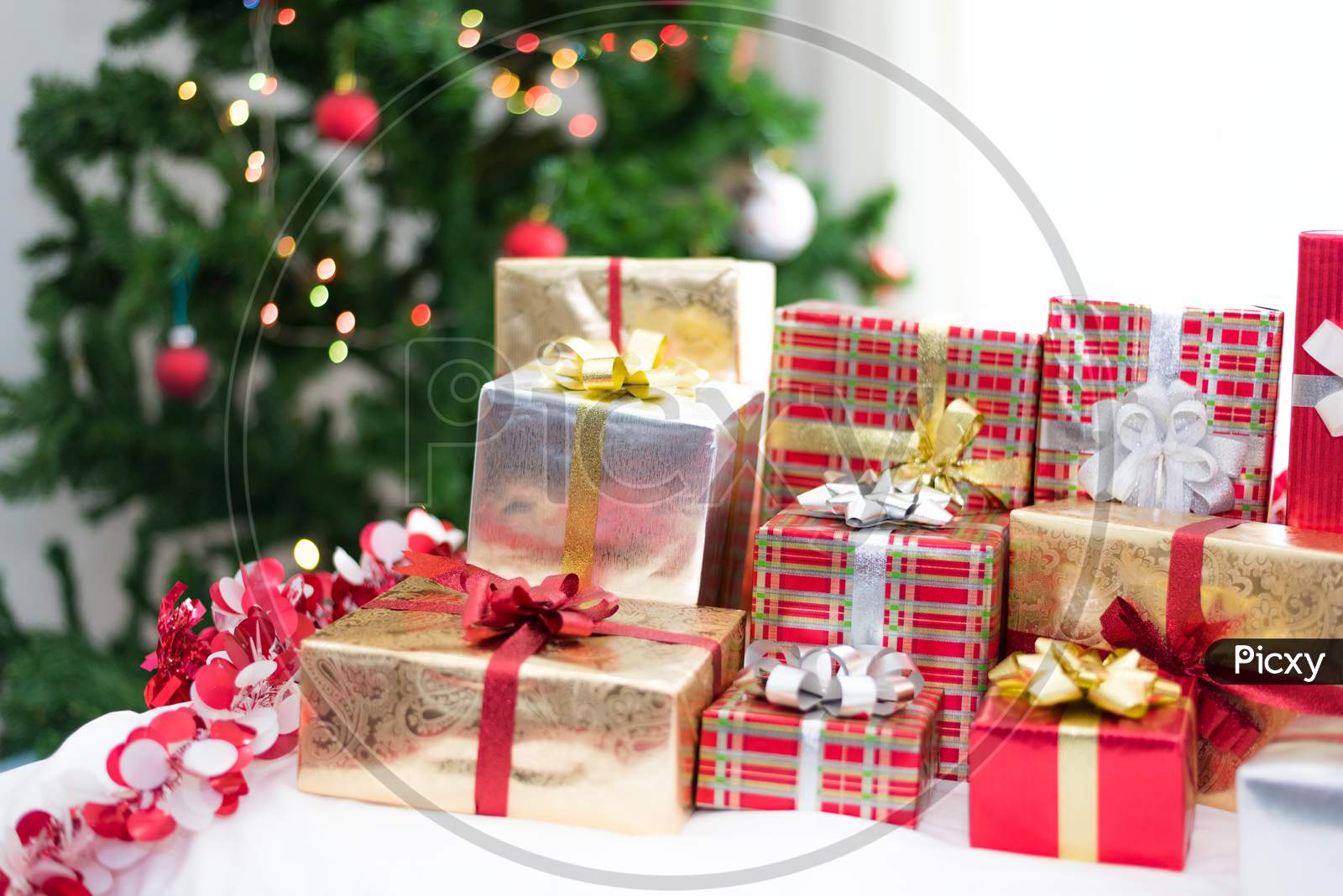 Gift Box With Christmas Tree Background For Surprise Children In New Year Or Xmas Party Festival. Relaxing Holiday And Object Concept. Christmas Party Event And Happy New Year Theme. Decorate Property