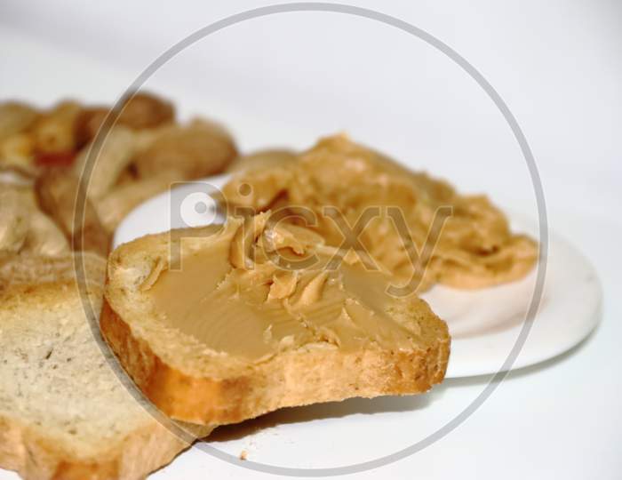 Toast With Peanut Butter On White Background