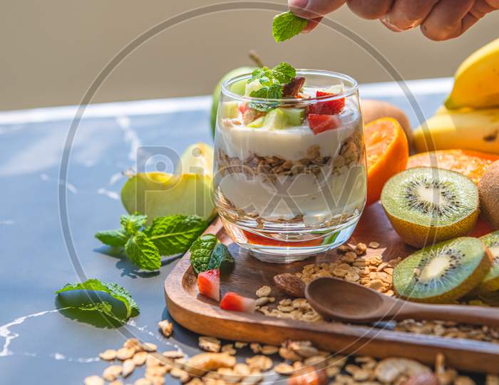 Closeup Nutrition Yogurt With Many Fruits On Table And Chef Hand. Food Cuisine And Drinks Concept. Organic Dessert Theme.